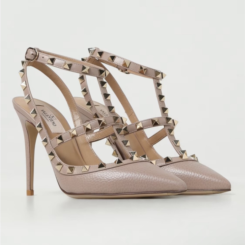 VALENTINO GARAVANI
Valentino Garavani Rockstud ankle strap pumps.